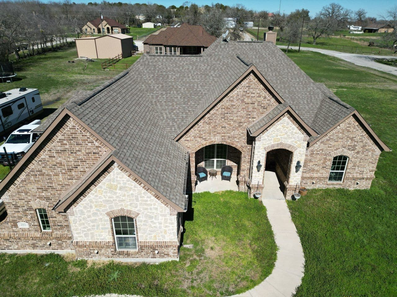 Roofing Transformation with Moire Black Shingles image