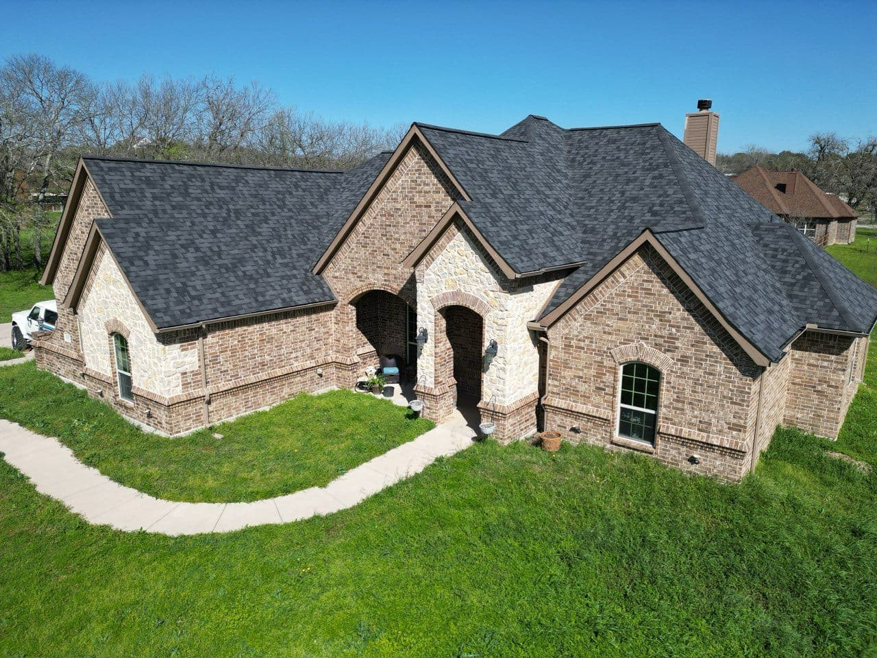 Gallery photos for Roofing Transformation with Moire Black Shingles: Image #1